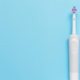 best electric toothbrush against blue background