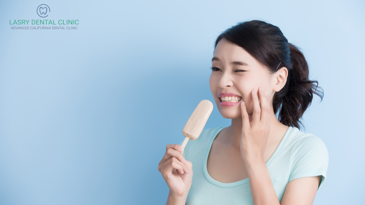 woman with sensitive teeth eating a popsicle
