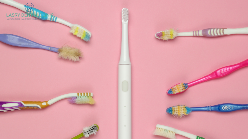 electric toothbrush surrounded by hard bristle manual toothbrushes -a soltuion for what to do about sensitive tteth