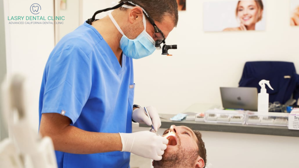 Dr. Lasry of Lasry Dental Clinic in LA, California prepping patient for Invisalign rubber bands
